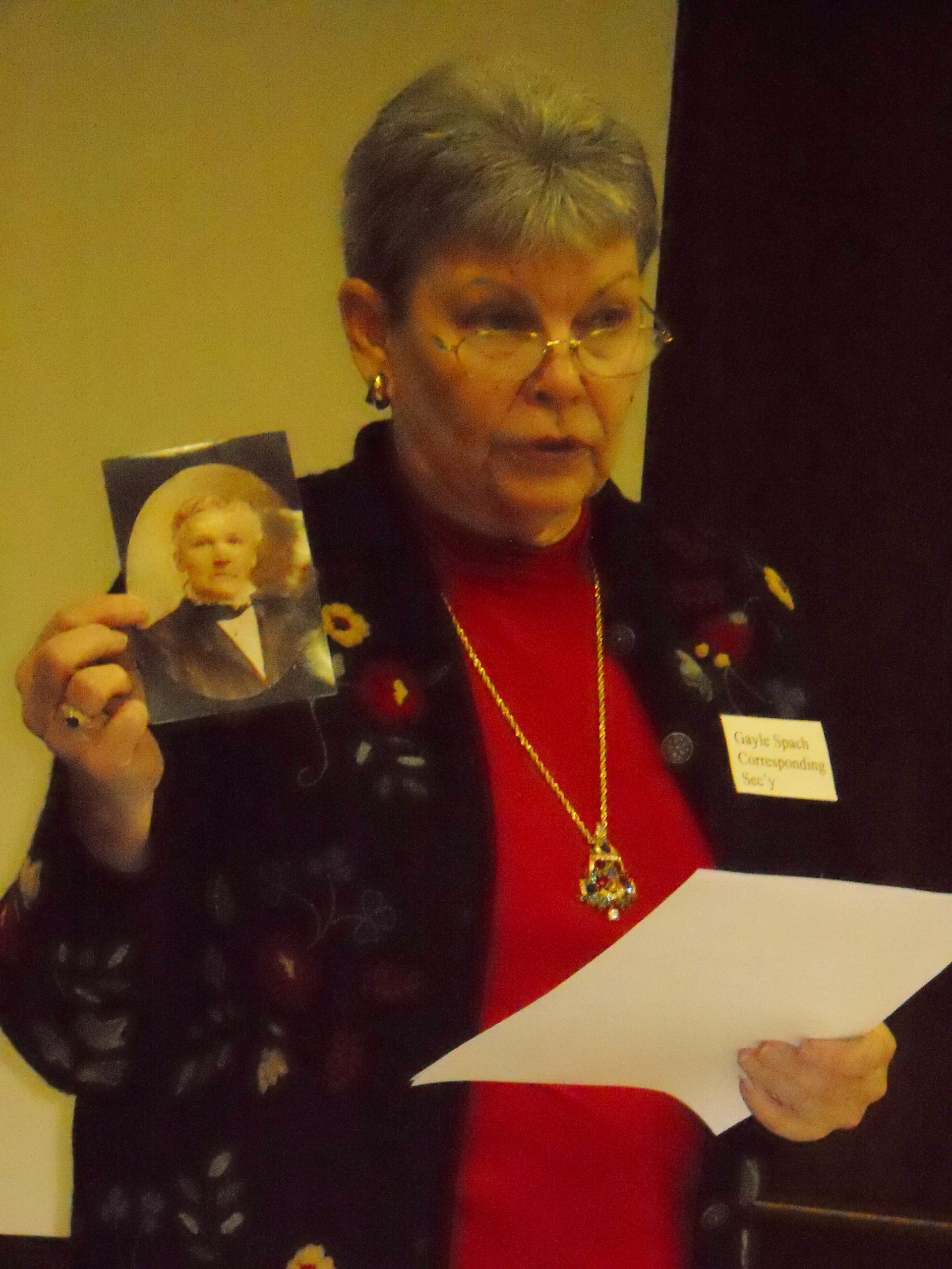 Gale Spock shows photo of her ancestor