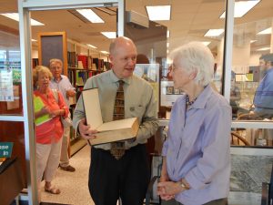 member Peggy Taylor gives Bible to NC Room